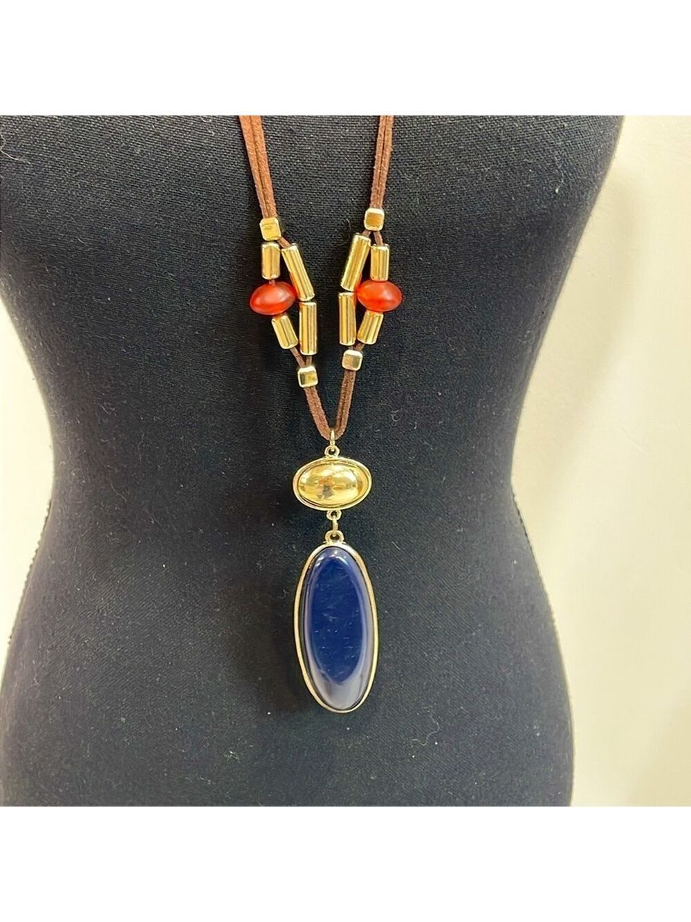 Chico’s leather long beaded necklace with gold and navy blue pendant
